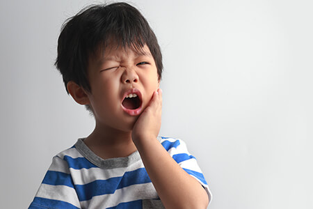 Boy with dental emergency