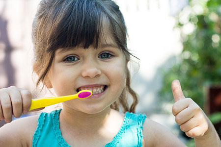 Girl brushing teeth