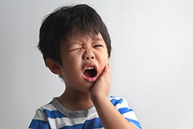 Boy with dental emergency